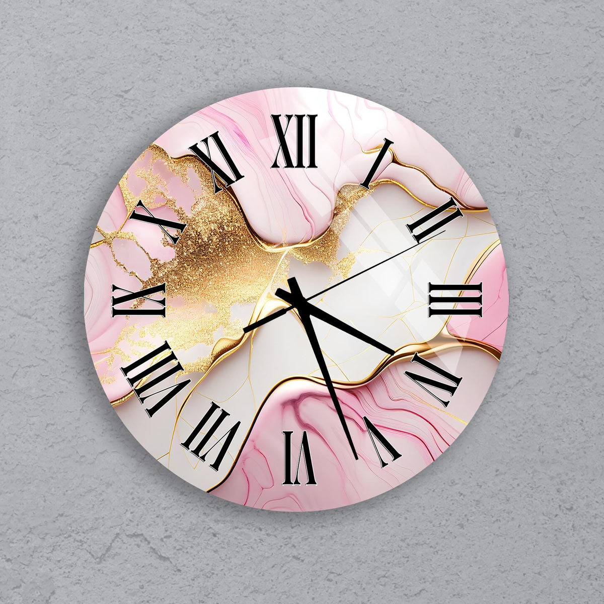 A round wall clock with a pink marble-like design and gold glitter accents.