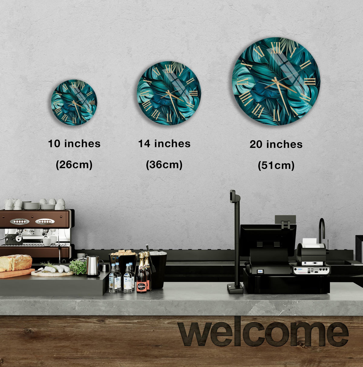a wall with three round wall clocks of different sizes, each displaying a tropical plant design. Below the clocks, there is a counter with various items such as bottles and a cash register. The word "welcome" is written on the counter.