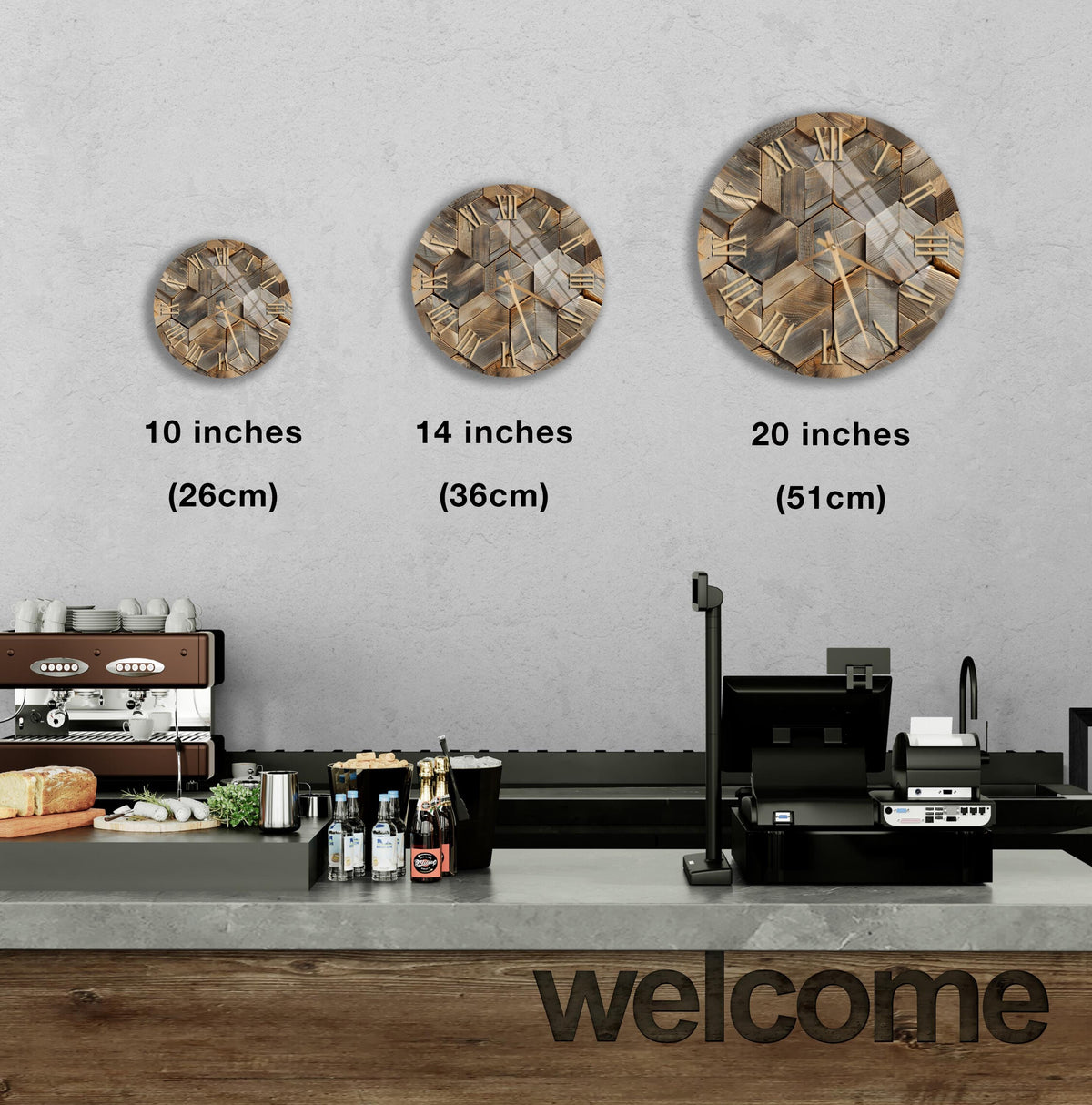 a counter in a restaurant with three different sizes of circular wall art displayed above it. The wall art is a geometric design in various shades of brown and beige. The counter has a cash register and other items on it, indicating that it is a commercial setting.