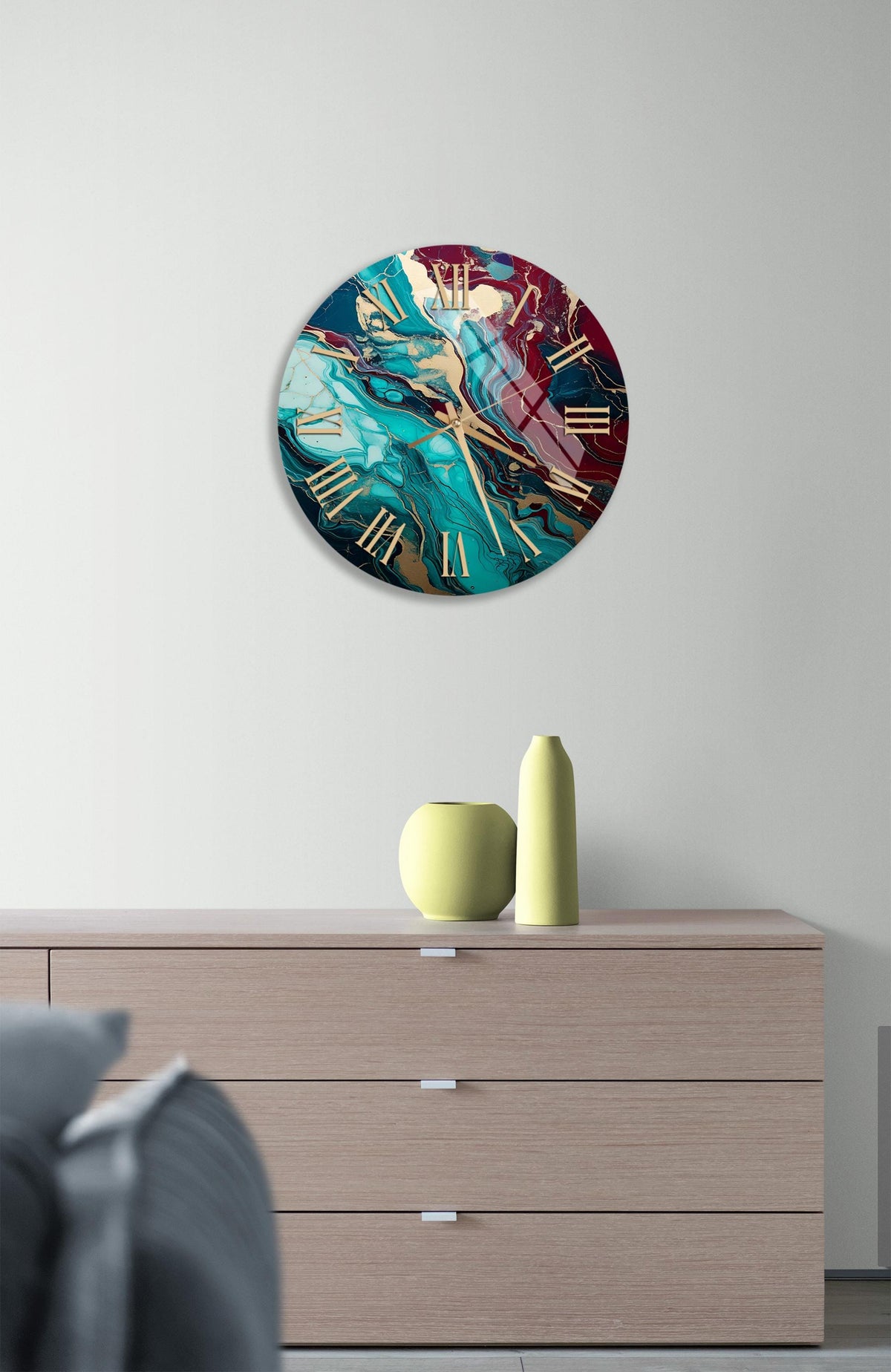 a clock on a wall above a dresser