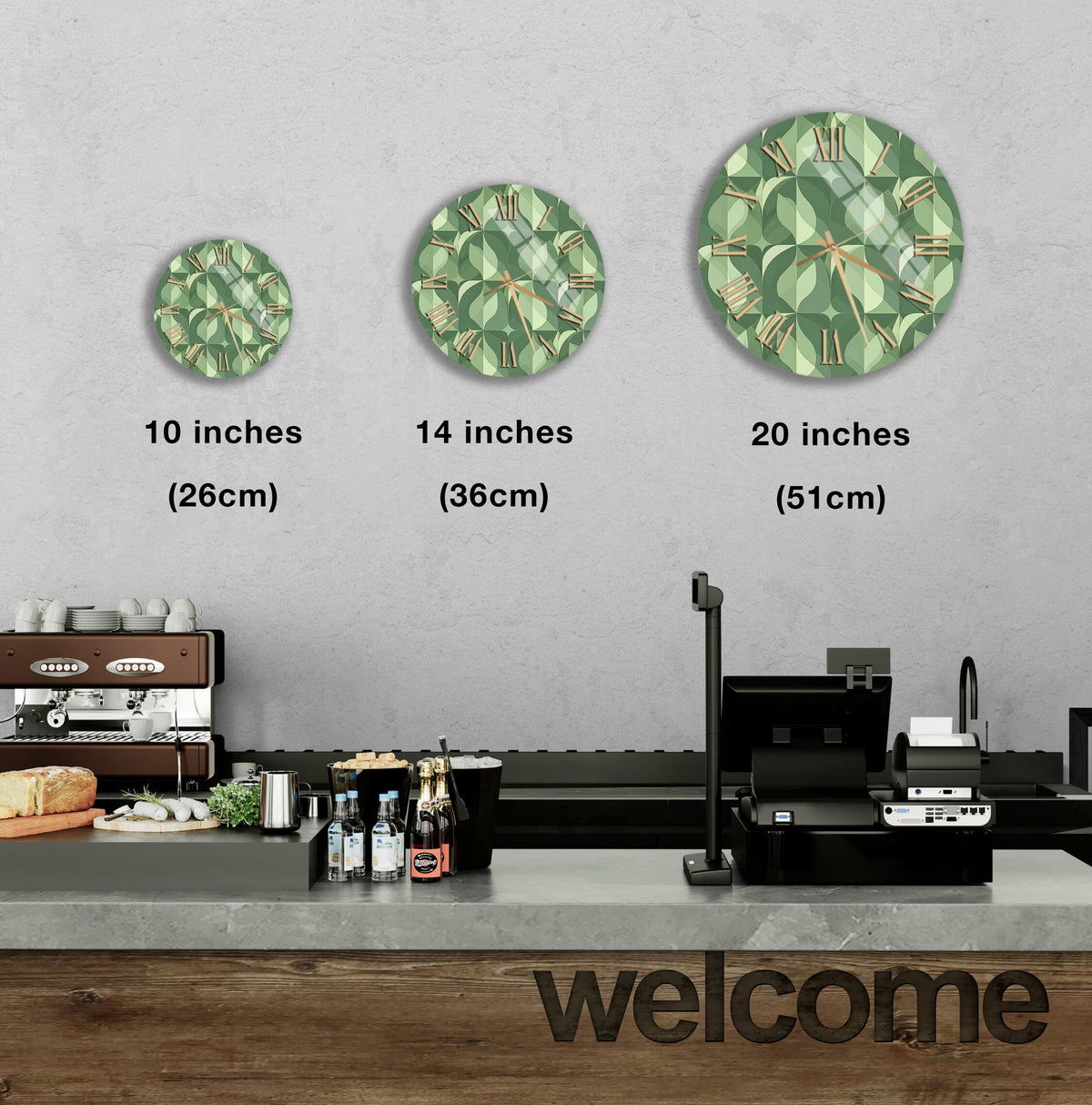 a counter with a cash register, a coffee machine, and various food items such as bottles and bread. Above the counter, there are three clock designs, each representing a different size: 10 inches, 14 inches, and 20 inches. The image also includes a welcome sign on the counter.