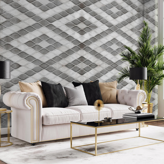 a modern living room with a white sofa adorned with black and gold throw pillows, a black and gold coffee table, and a large potted plant. The room has a geometric patterned wall behind the sofa, and the overall design has a luxurious and sophisticated feel.