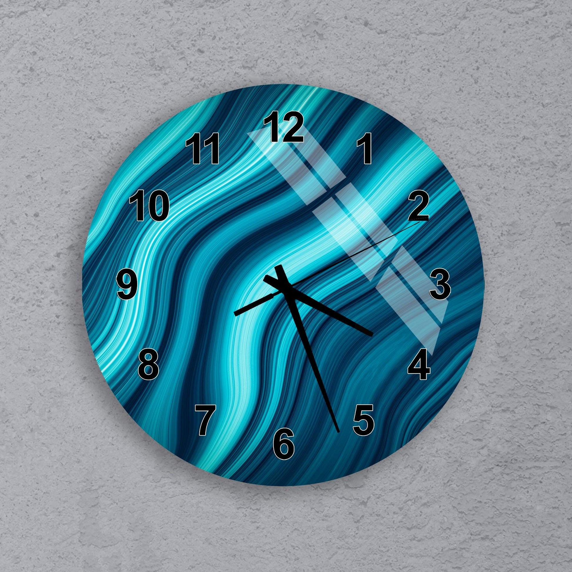 A wall clock with a blue and teal swirl pattern on its face.
