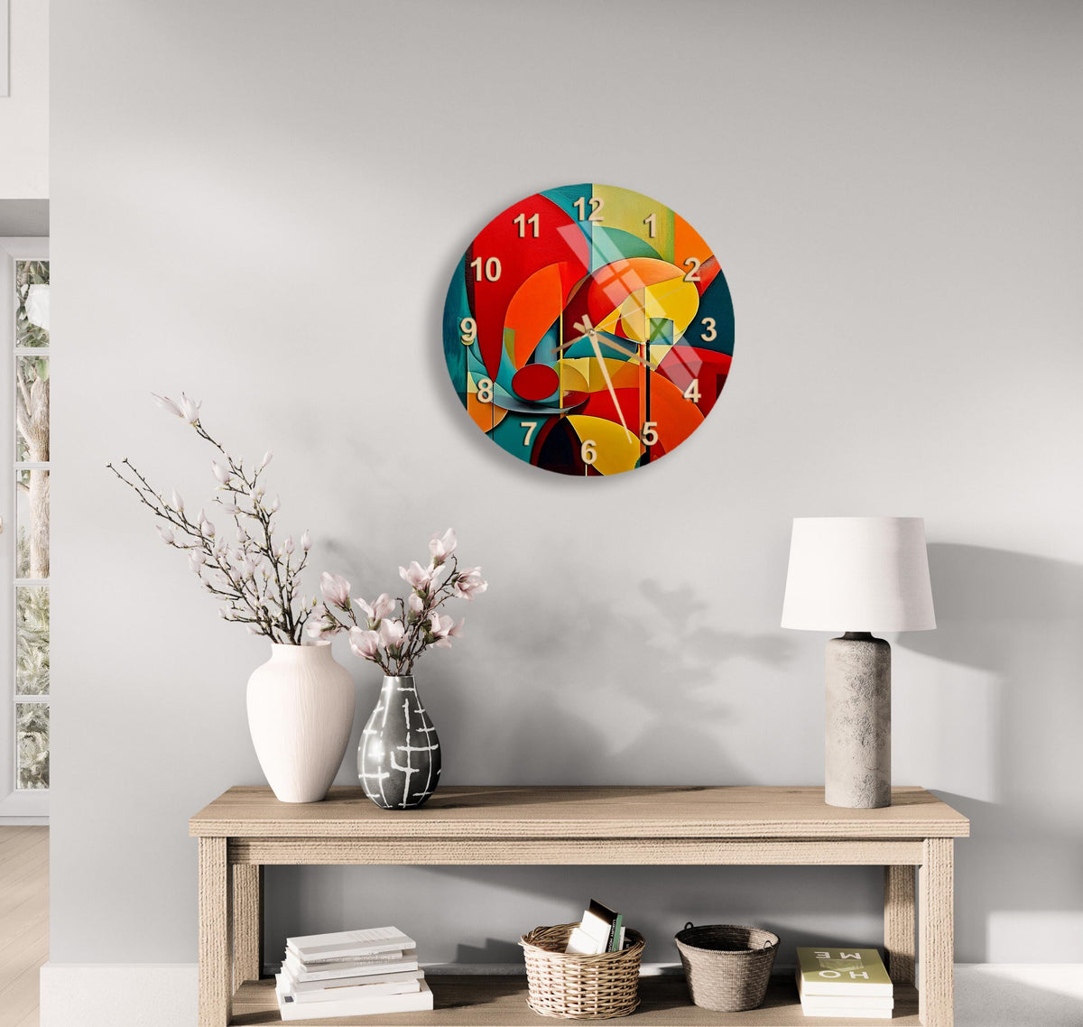 a clock on a wall with a vase of flowers on a table